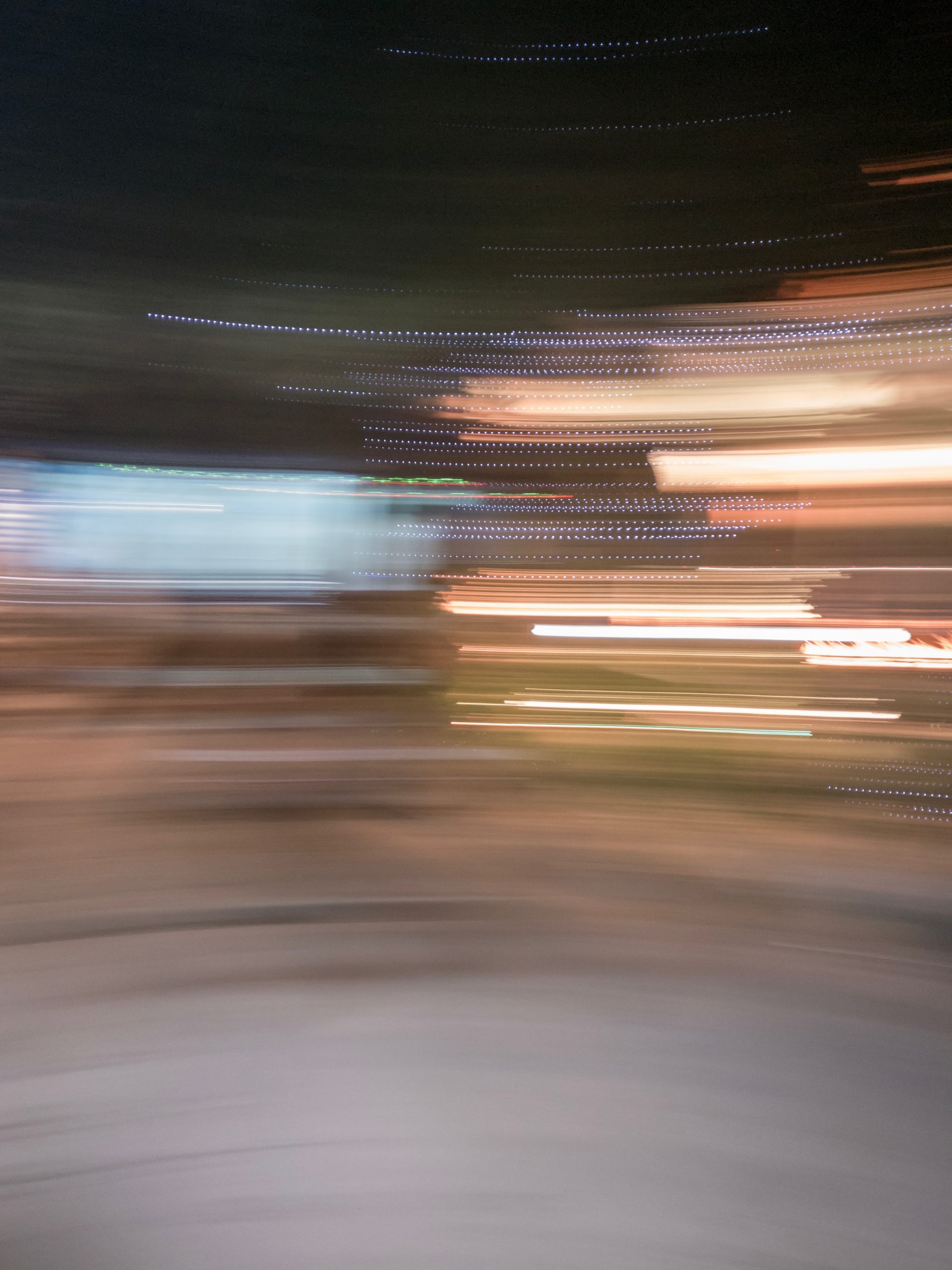Blurred streaks of city lights at night