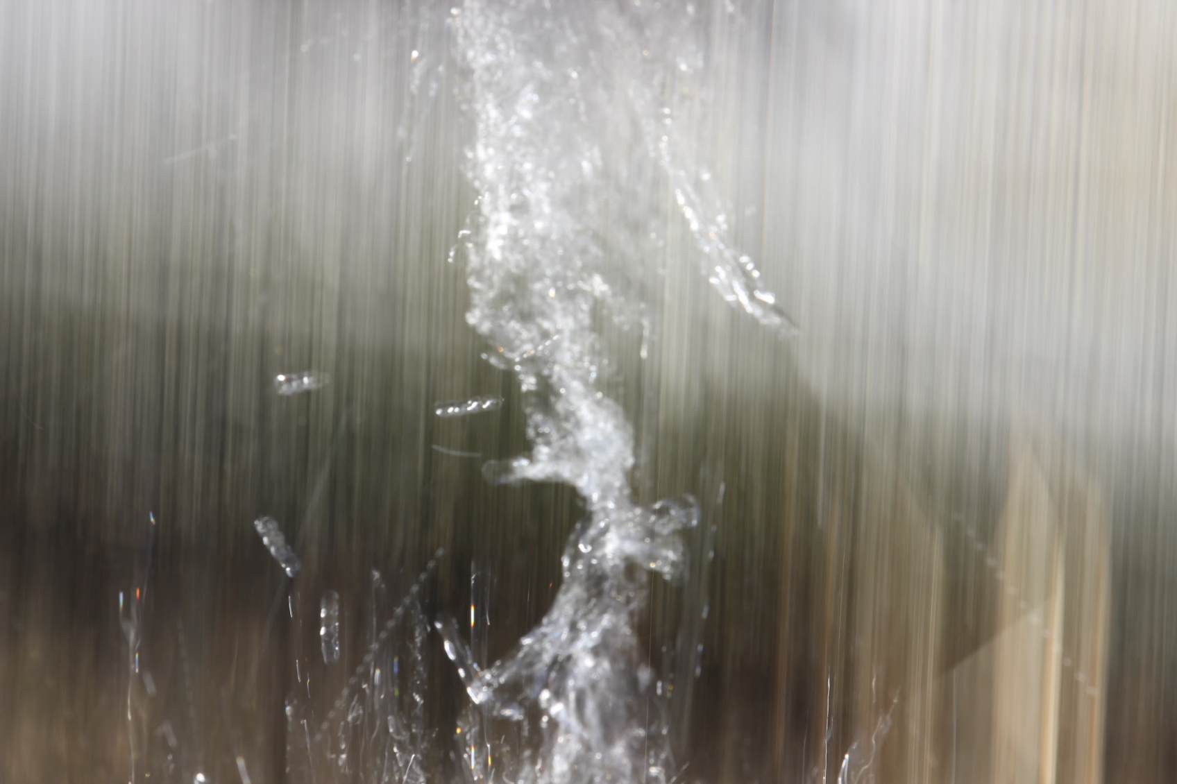 Water splashing against a streaked, rain-like background